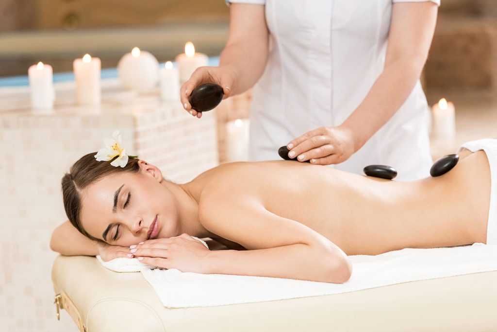 Massage-Therapy-woman-getting-hot-stone-massage-therapy